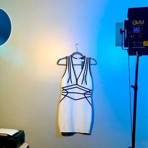 Brand new white and black little dress. Never worn. Size Medium. 4-6 dress size.